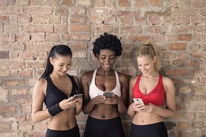 women checking their phones